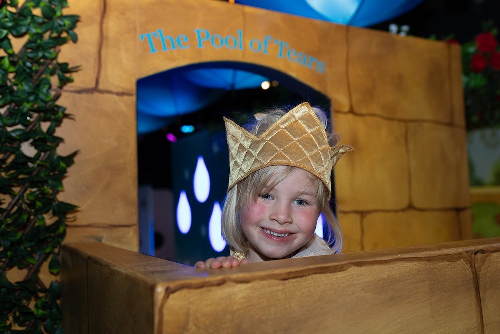 Z-ARTS ADVENTURES IN WONDERLAND a child dressed up