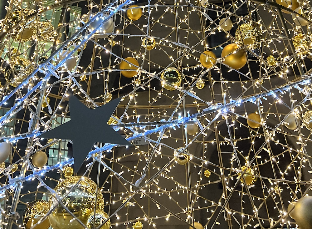Christmas Light Switch On Rochdale with gold lights and stars
