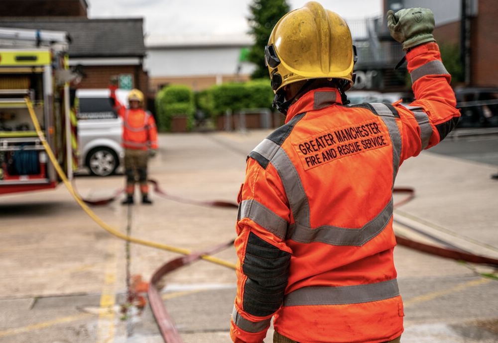 Greater Manchester Fire Stations Open Days a fireman with a hose 