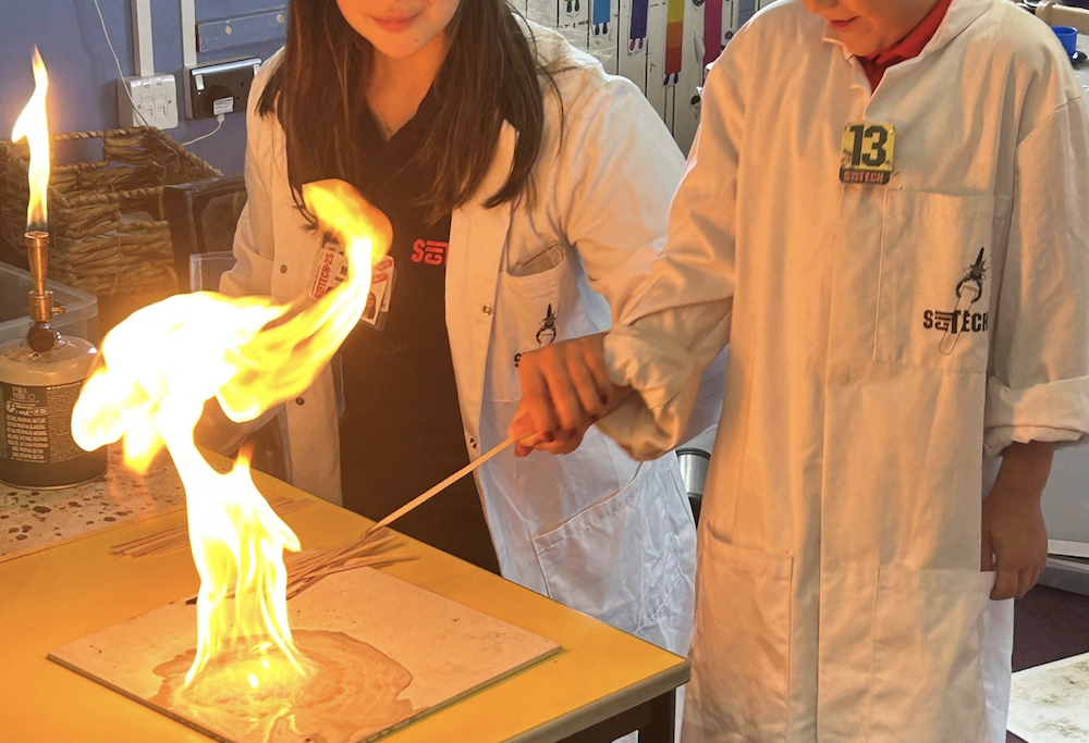 Scitech Portland Basin children doing a science experiment with fire