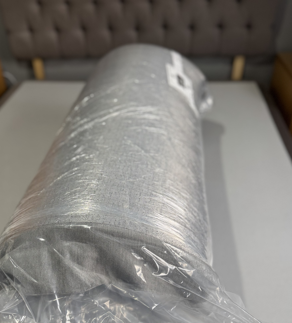 Simba Hybrid Mattess Review set up the mattress rolled up on on a bed base
