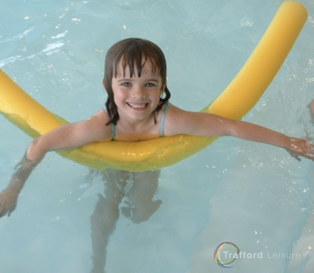 child on a float at Swimming Party Partington Sports village