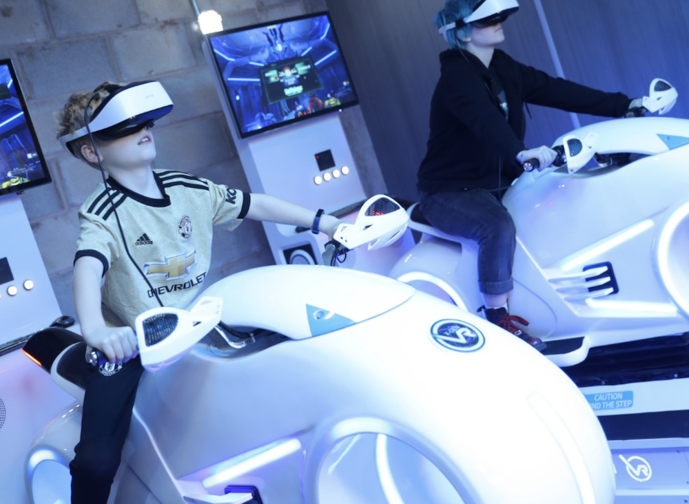 Kids on simulator at VR Arcade Stockport